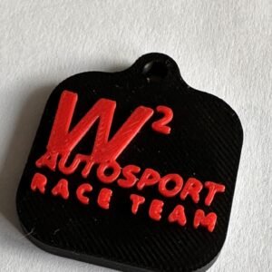 Black W² Autosport NFC tag with raised red race team logo and attachment hole